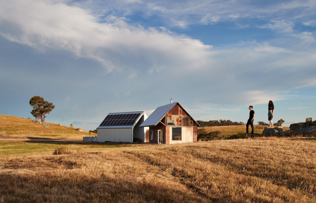 This Picture of farmhouse redefine rural living, incorporating smart technologies that make sustainability as effortless as a walk through the fields, enhancing comfort and eco friendliness hand in hand.